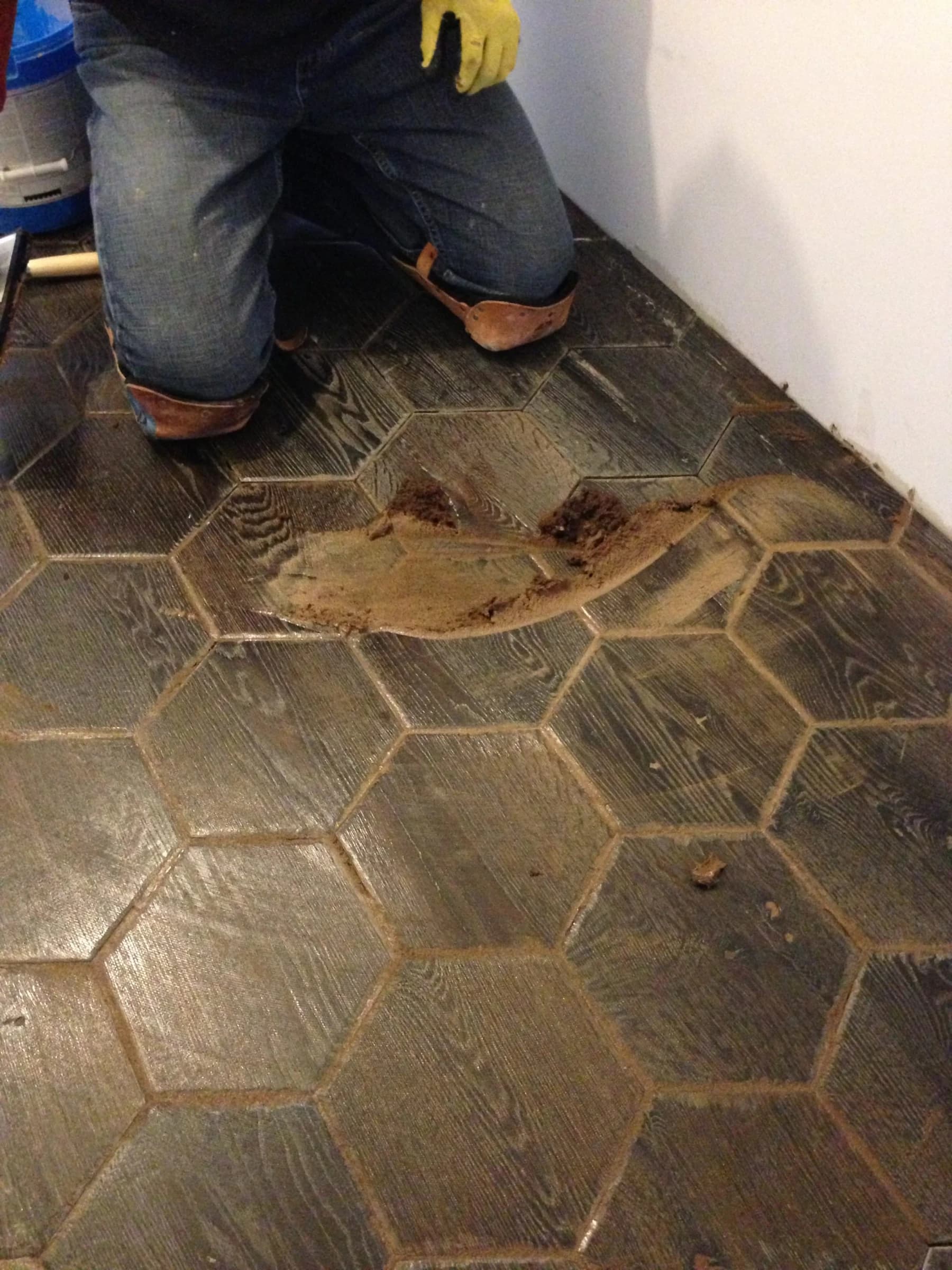 An Ace craftsperson fitting detailed hexagonal parquet in Lincoln Park