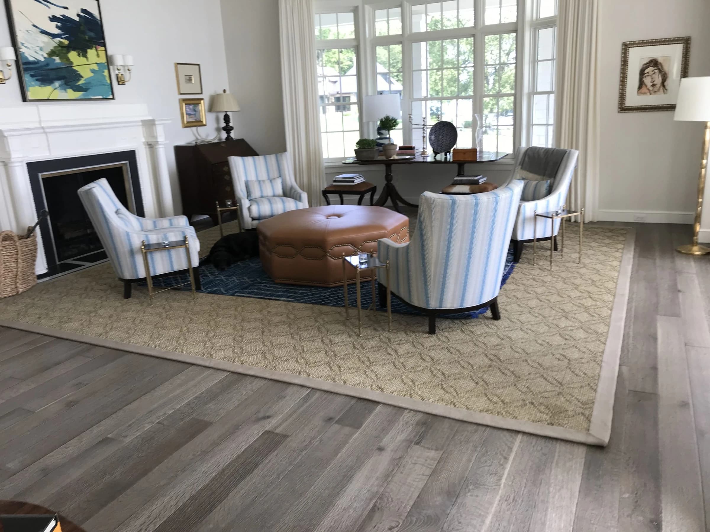 Warm wood flooring in a sunlit sitting room from Ace’s gallery